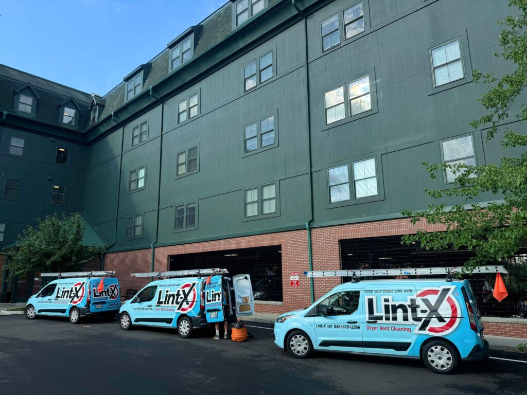 Lint-X vans preparing for multi-unit dryer vent cleaning